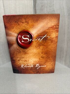 The Secret by Rhonda Byrne — Brown Cover with Red Seal